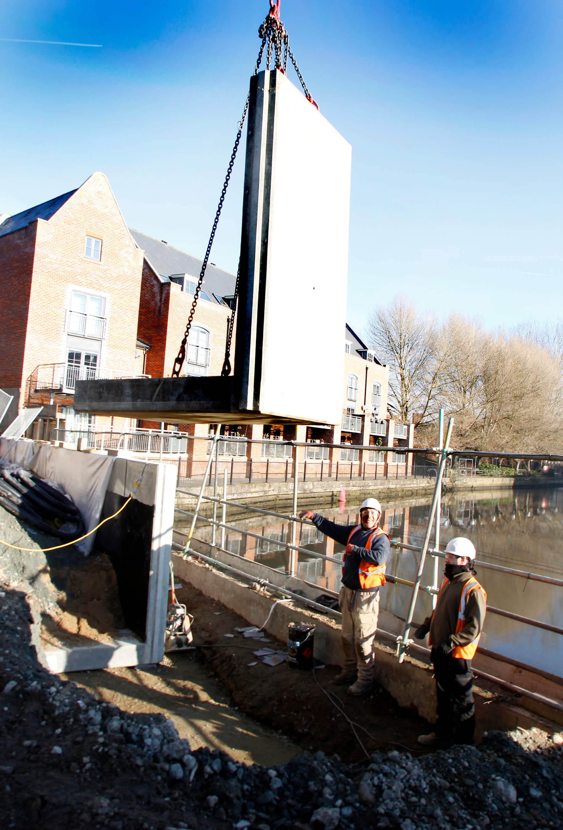L-bloc concrete units being lowered into position at St Anne's Wharf, Norwich